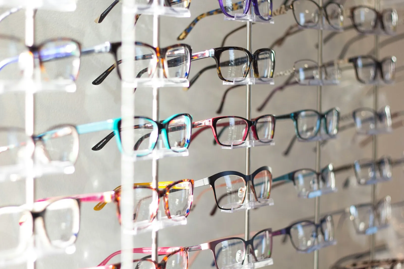 Rows of colorful frames arranged on a boutique rack