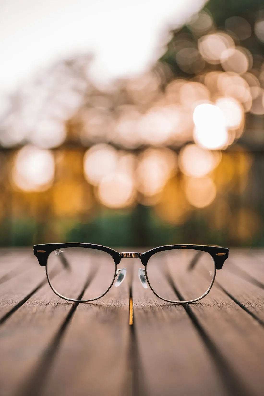Understated black frames on a wooden table