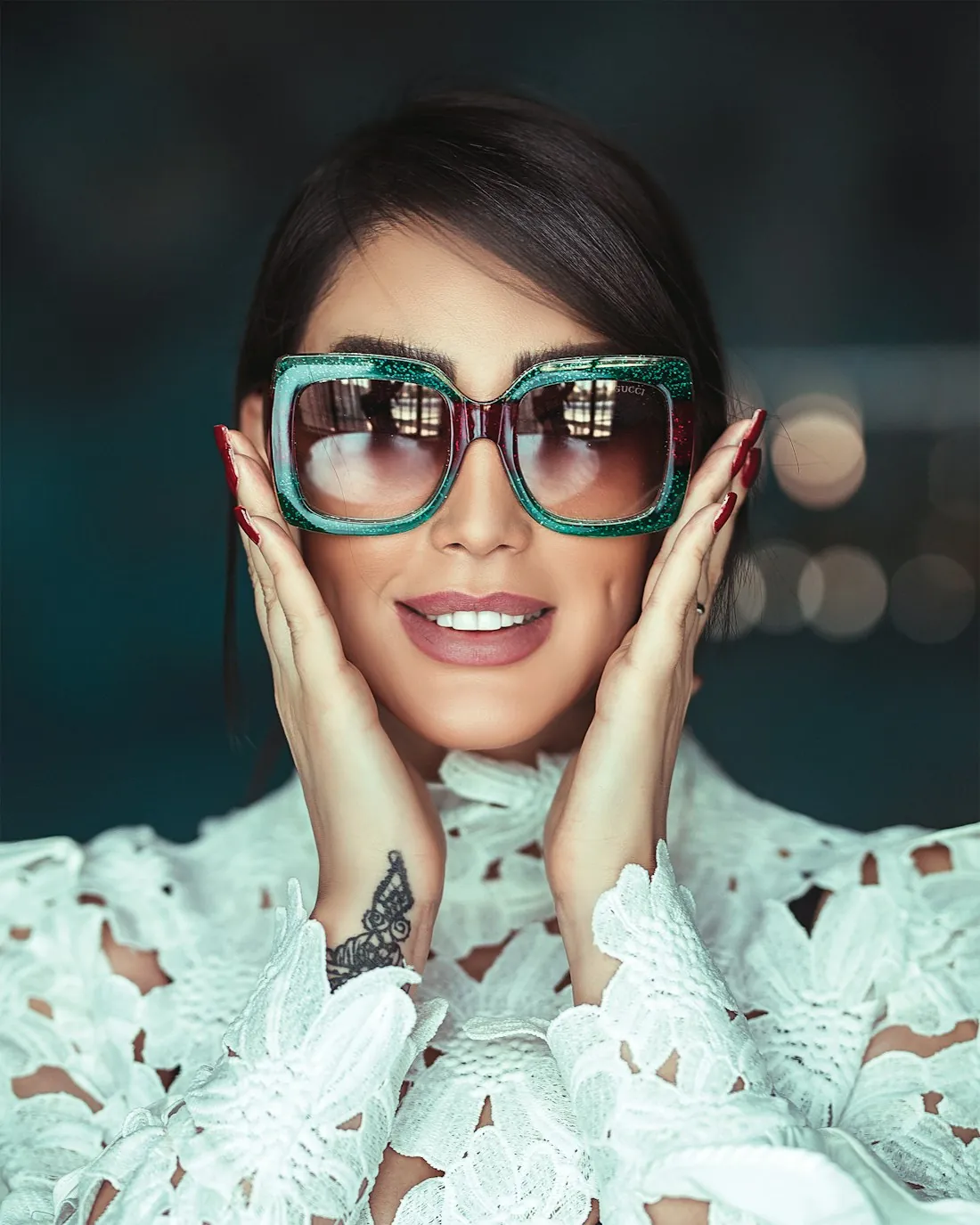 Woman in bold green statement sunglasses