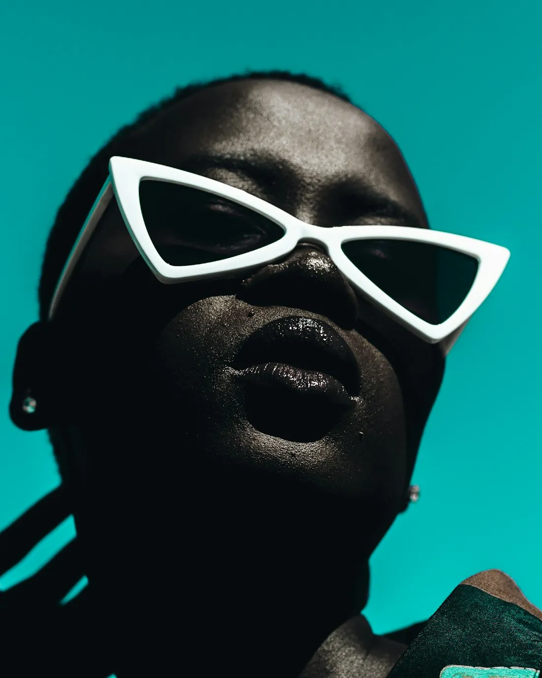 Model in bold white statement sunglasses